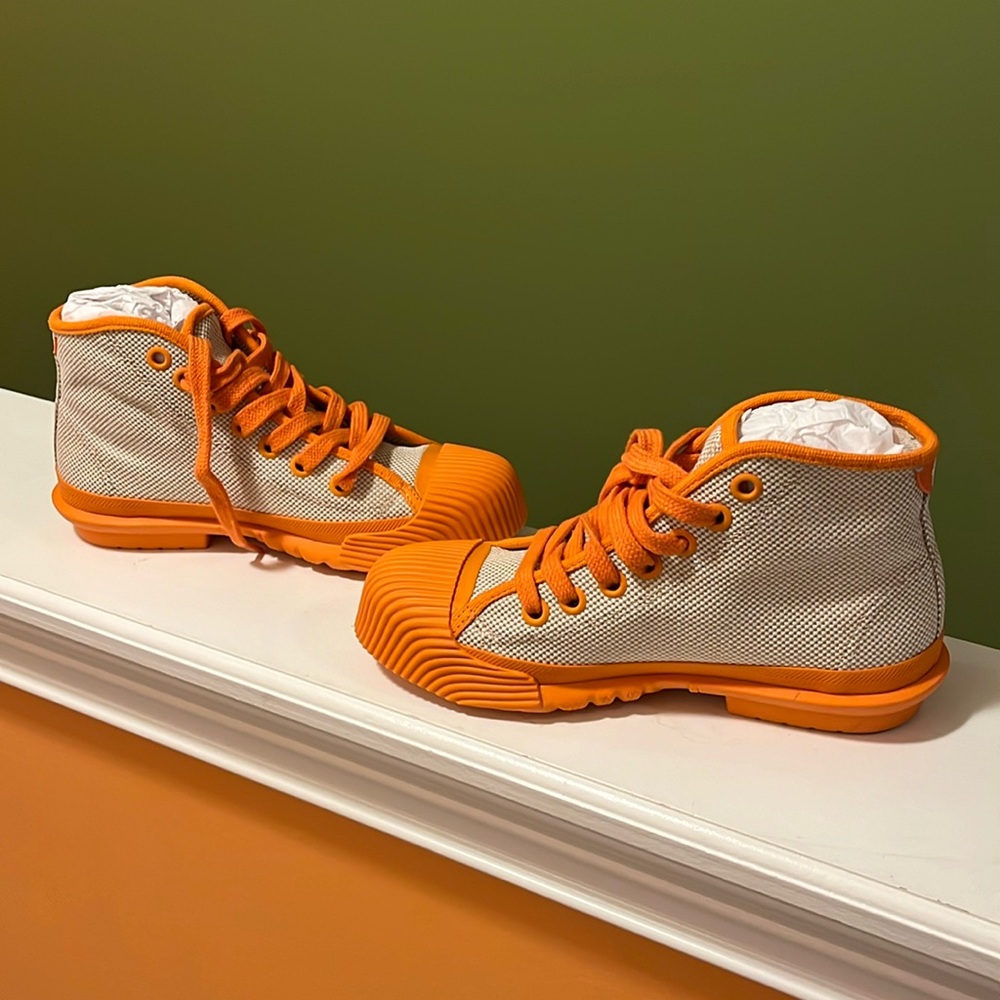 Tori Burch NIB Off White/Orange Juice high top canvas sneaker.